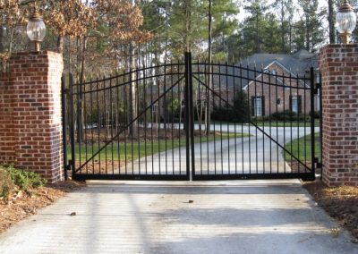 A large size entry gate attached to brick walls