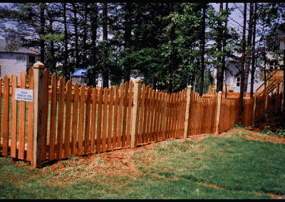 High natural wood fencing with curves