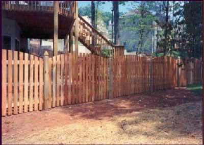 Decorative wooden fencing around a farmhouse