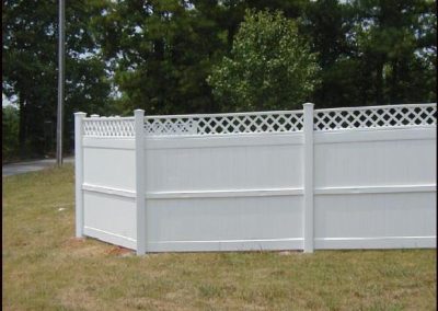 A solid white no gap fencing with a crisscross design on top