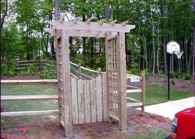 A farm gate with a square alter for entry