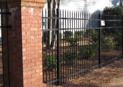 Metal fencing attached to brick pillars