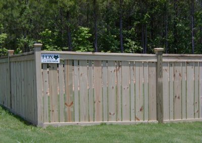 A white wood small gap fencing with square dividers