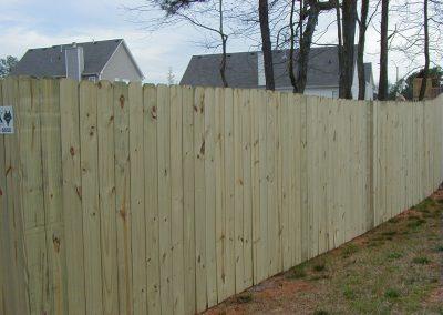 A picture of long stretched wooden fencing