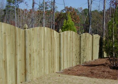 A decorative wooden fencing with rounded top