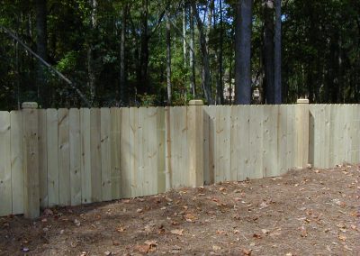 A medium height white wood fencing