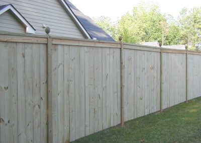 White natural wooden fencing with lotus bus design in the joints