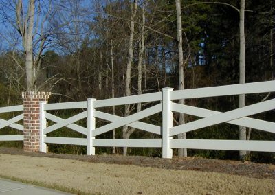 Gorgeous whitewashed fencing made between brick pillars