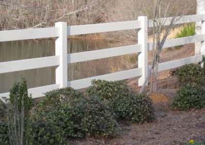 A plain whitewashed low, height fencing