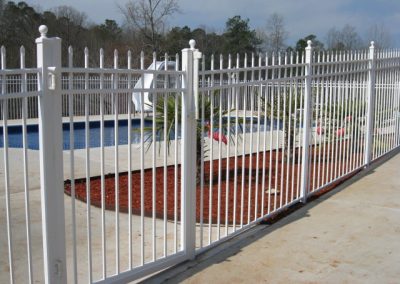 A whitewashed metal fencing with square dividers