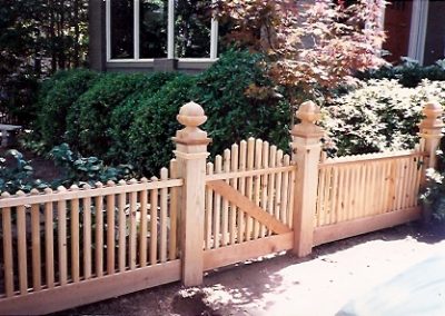 Decorative wooden fencing with a beautiful entry gate